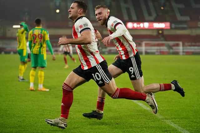 Sheffield United's Billy Sharp (left) celebrates scoring his side's second goal of the game against West Bromwich Albion: Dave Thompson/PA Wire.