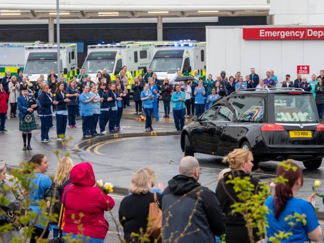 The bagpipes sounded as the hearse passed the A&E department.