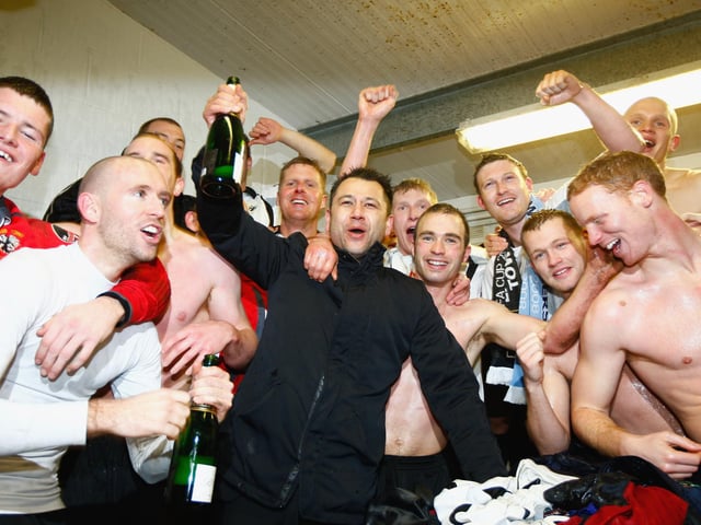 Eastwood chairman Rob Yong at the centre of the celebrations.