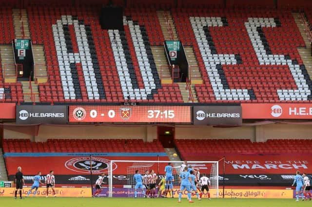 Sheffield United defend an attack in front of empty stands during the Premier League football match between Sheffield United and West Ham United at Bramall Lane (Photo by MIKE EGERTON/POOL/AFP via Getty Images)