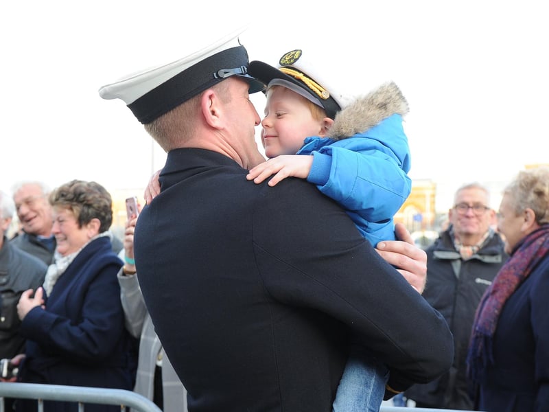 Ben Smith with Blake, three, following HMS Queen Elizabeth's return to Portsmouth after her US deployment. Picture: Habibur Rahman