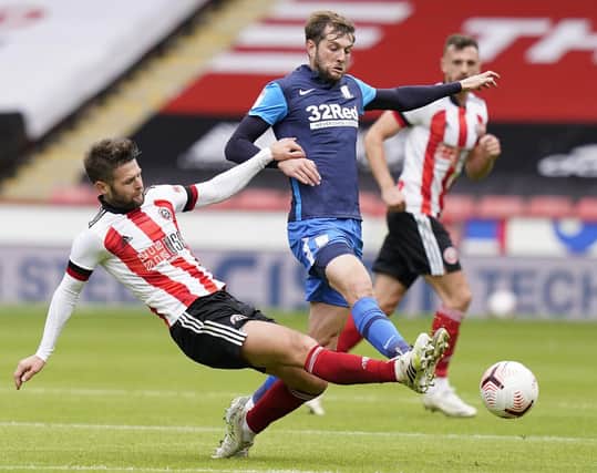 Oliver Norwood of Sheffield Utd (L) tackles Tom Barkhuizen of Preston during the Pre Season Friendly match at Bramall Lane, Sheffield. Andrew Yates/Sportimage