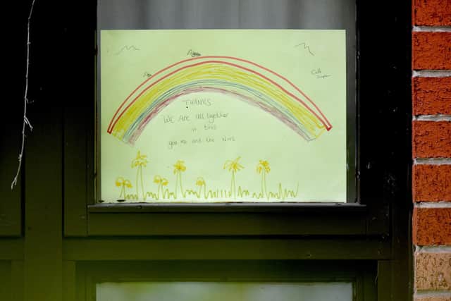 A rainbow poster, used as a symbol of hope during the coronavirus pandemic, is seen in the window at MHA Laurel Court care home in Manchester, northwest England, on April 15, 2020. - The reported COVID-19 death toll in the UK passed the 12000 mark as fears grow about the true number of deaths in UK care homes, with charities sounding the alarm that there have been many more fatalities than reported. (Photo by Anthony Devlin / AFP) (Photo by ANTHONY DEVLIN/AFP via Getty Images)