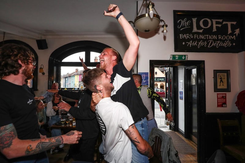 Fans pictured in The Kings pub celebrating as England score their first goal. Picture: Stuart Martin (220421-7042)