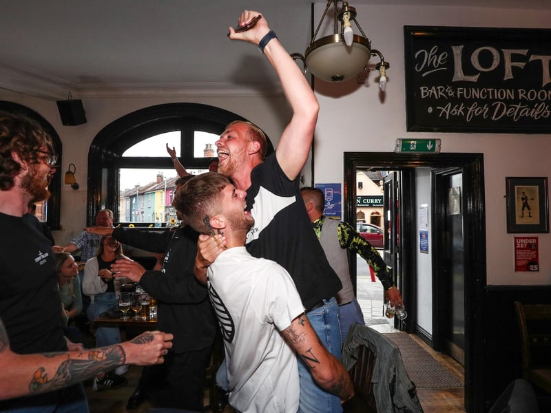 Fans pictured in The Kings pub celebrating as England score their first goal. Picture: Stuart Martin (220421-7042)