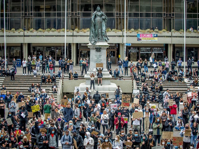 Hundreds of demonstrators gather beneath the Civic Offices and the statue of Queen Victoria.