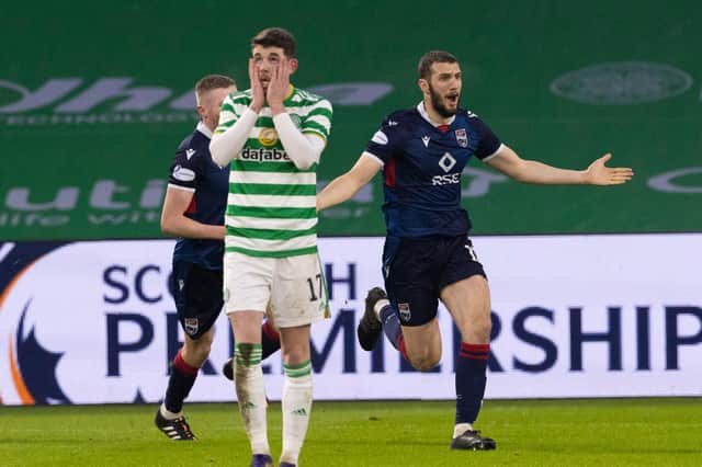 Celtic's Ryan Christie reacts as Ross County's Alex Lacovitti (R) celebrates making it 2-0 . (Photo by Alan Harvey / SNS Group)