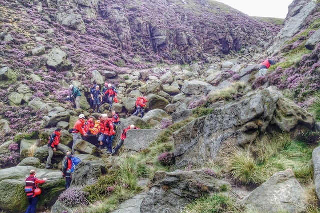 Buxton Mountain Rescue Team assisting a child who had fallen in the upper reaches of Grindsbrook Gorge, Kinder Scout in 2014