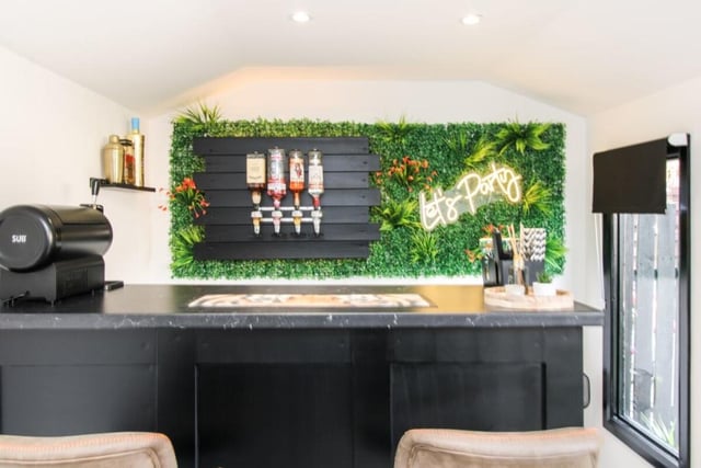 Summerhouse bar with living wall decoration.