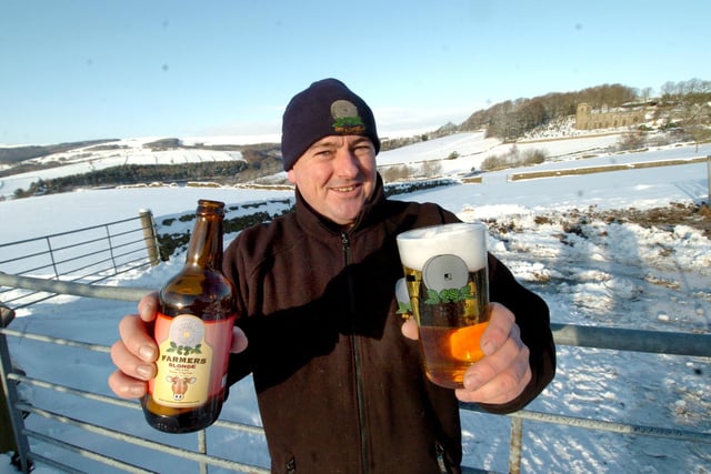 Owner John Gill at Bradfield Brewery, Watt House Farm, High Bradfield, with a pint of his Farmers Blonde beer in  2010