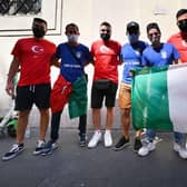 Turkey and Italy fans pose together in Rome. Photo: ALBERTO PIZZOLI/AFP via Getty Images