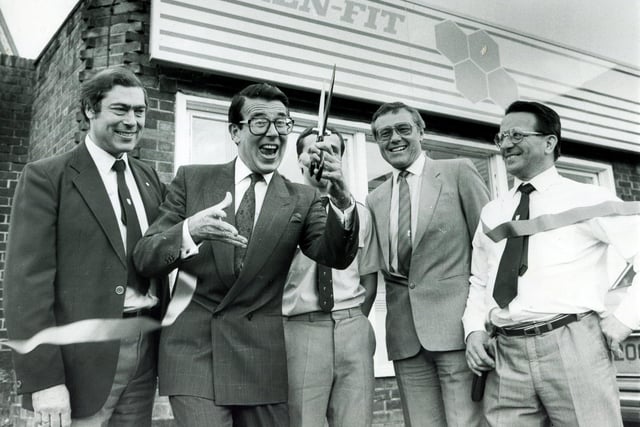 Comedian and television presenter Leslie Crowther cuts the tape to open Ken-Fit, part of Kenning Tyre Services,  watched by Mr Ray Fuller, managing director of Kenning Tyre Services, Mr Steve Crossland, depot manager, Mr Ken McDonald, regional manager, and Mr Alan Walton, divisional manager - April 1987