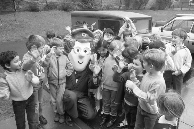 There was no mistaking the new boy... Even without his black and white cat, Postman Pat was a definite hit with the youngsters at Chorley St James's School. He called in at the Devonport Way site in his vintage Austin Seven post van to launch the start of Book Week