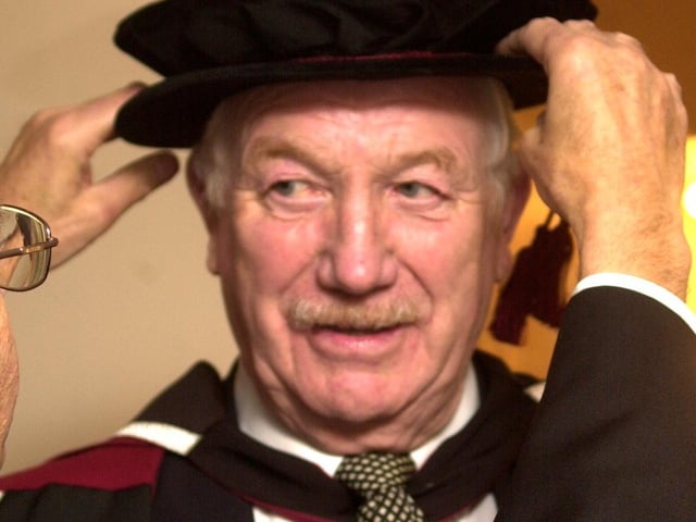 Sheffield football legend Derek Dooley is seen being prepared to receive his honorary doctorate at a Sheffield Hallam University degree ceremony in 2003