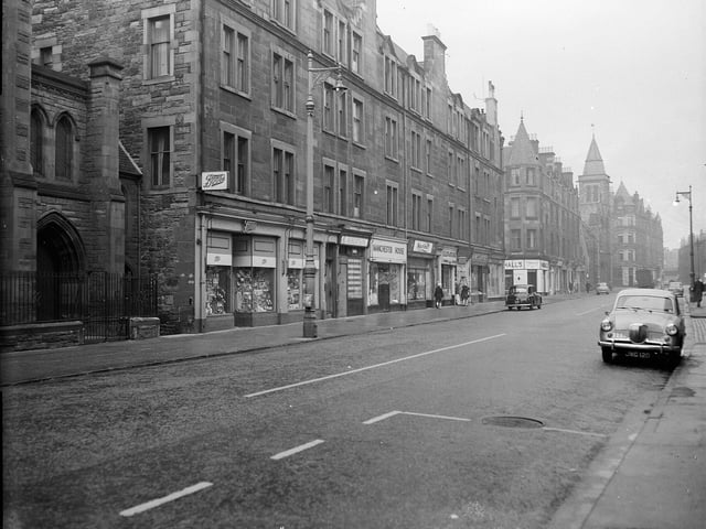 A photograph of shops on Dalry Road, looking east, taken in October 1962.