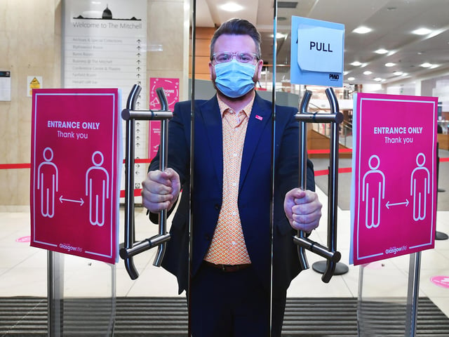 Chair of Glasgow Life, Councillor David McDonald opens the doors at the Mitchell.