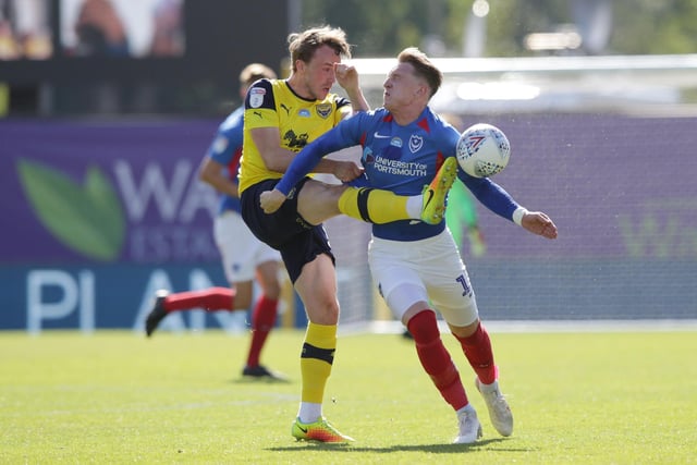Sam Long of Oxford United clears from Ronan Curtis