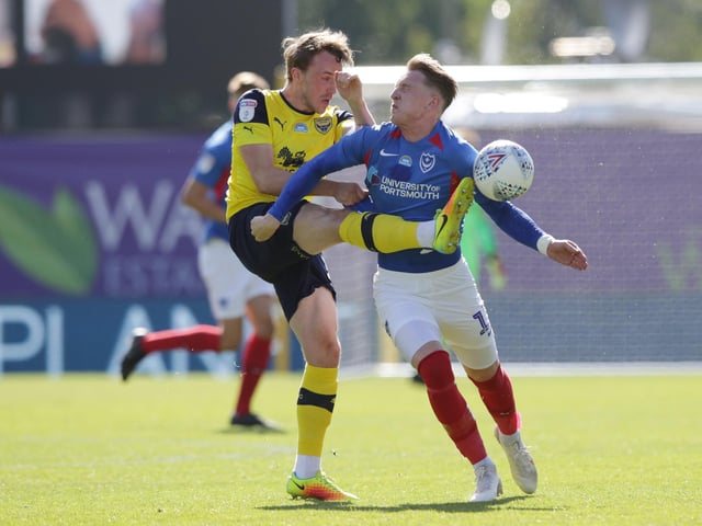 Sam Long of Oxford United clears from Ronan Curtis