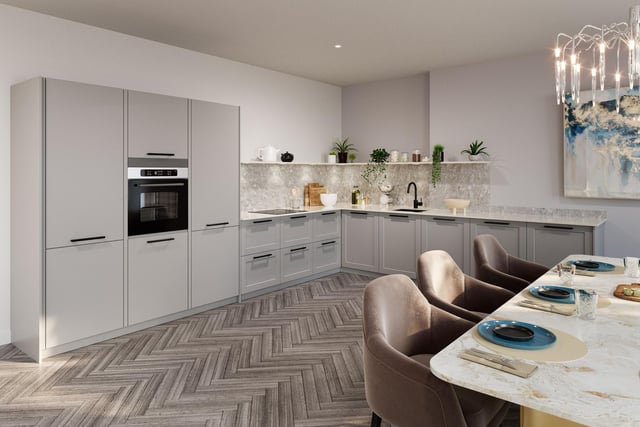 The kitchen of this £715,000 property will look very modern, with the white appliances reflecting natural light all over the room.