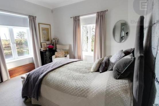 The first bedroom is downstairs and has an en-suite bathroom. The room has a great amount of space and has been well decorated with a soft colour palette.