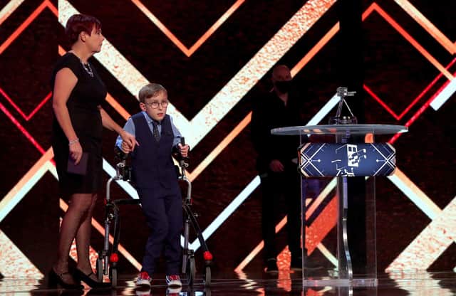 Young Unsung Hero winner Tobias Weller with his mother Ruth Garbutt during the BBC Sports Personality of the Year 2020 at MediaCityUK, Salford. Photo: Peter Bryne/PA Wire