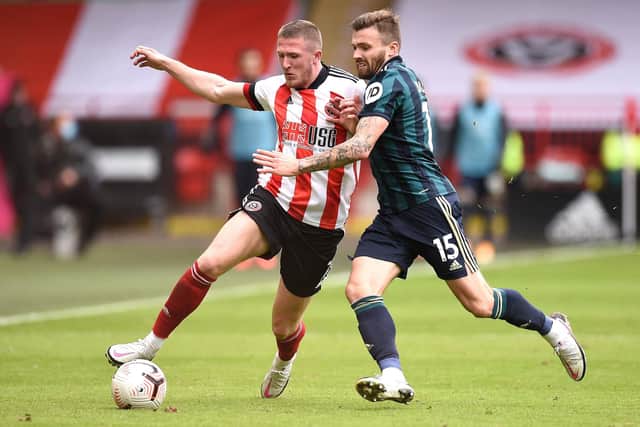 Sheffield United's John Lundstram (left) and Leeds United's Stuart Dallas battle for the ball: Oli Scarff/NMC Pool/PA Wire