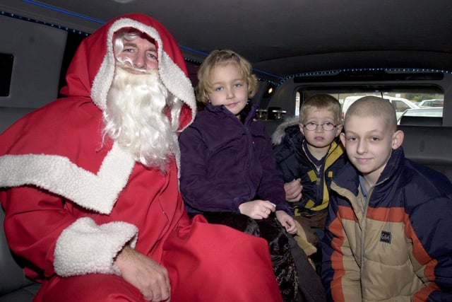 Father Christmas takes Sheffield Children's' Hospital patients, l/r: Brogan Hough(7), Declan Booth(4) and Sean Riley(10) on a school trip in his stretch limo.                                         November 27 2001