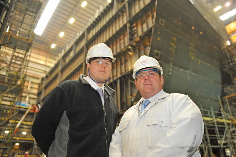Nick East, mechanical manager and Kevin Lee, electrical manager, infront of parts of the HMS Queen Elizabeth in construction with Portsmouth Naval Base in 2010. Picture: Sarah Standing (104168-1126)