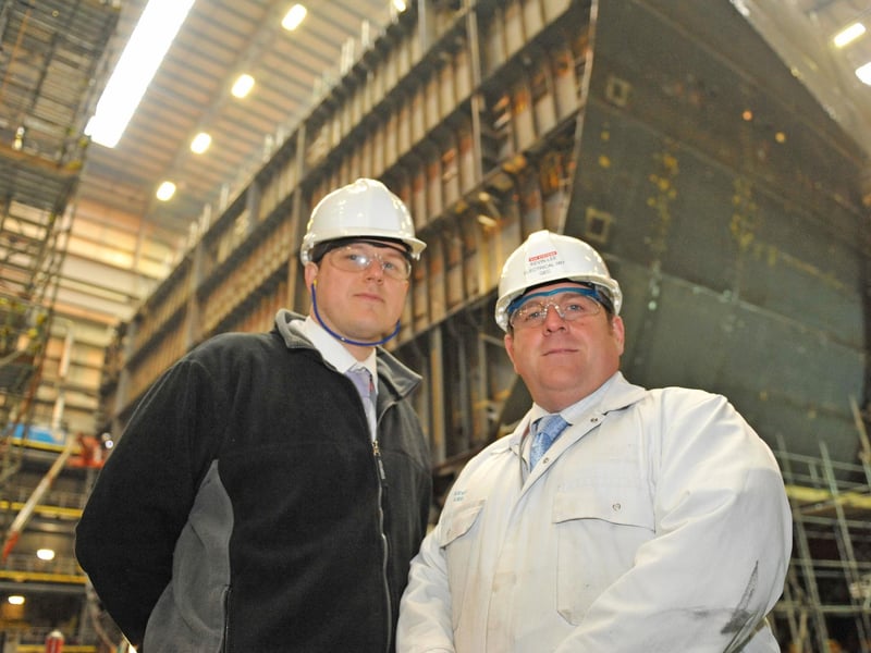Nick East, mechanical manager and Kevin Lee, electrical manager, infront of parts of the HMS Queen Elizabeth in construction with Portsmouth Naval Base in 2010. Picture: Sarah Standing (104168-1126)