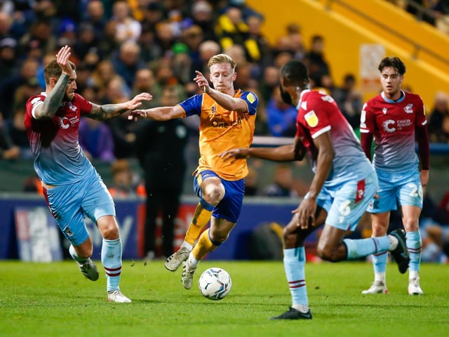 Mansfield Town Harry Charsley pushes through midfield.