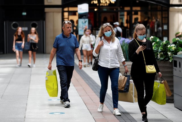 Shoppers wearing face masks at Gunwharf Quays
