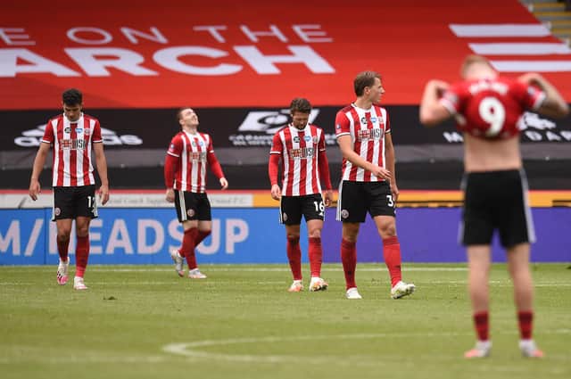 Sheffield United players react after Dani Ceballos of Arsenal (not pictured) scores his teams second goal during the FA Cup Fifth Quarter Final match between Sheffield United and Arsenal FC at Bramall Lane on June 28, 2020 in Sheffield, England. (Photo by Oli Scarff/Pool via Getty Images)