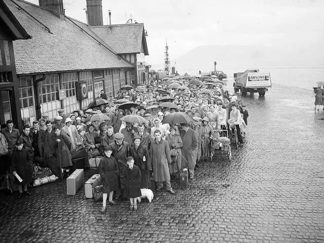 Queuing in the rain for the ferry at Gourock during the Glasgow Fair holiday in 1956.