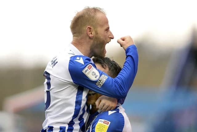 Barry Bannan and Lee Gregory celebrate the winning goal against AFC Wimbledon on Saturday.