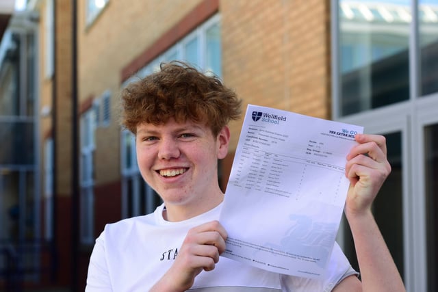 Alex Wade collects his grades.