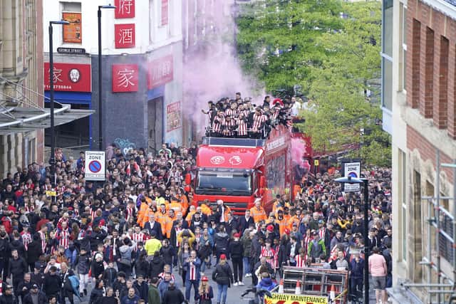 Sheffield United players on an open top parade bus during the celebrations in Sheffield City Centre: Danny Lawson/PA Wire.