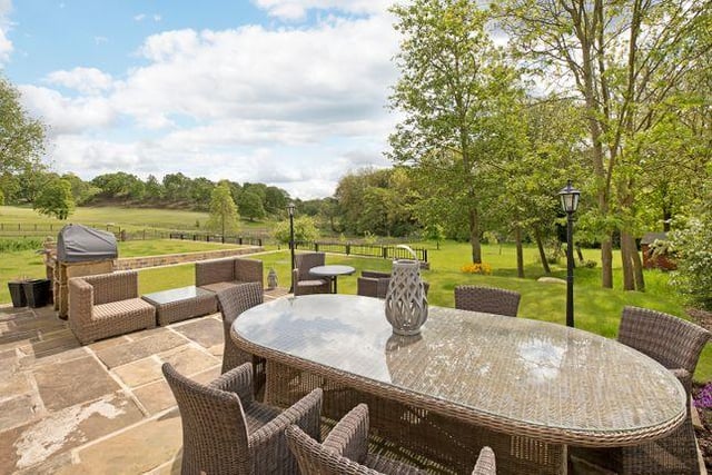 The well kept grounds offer formal lawns and patios, alongside steps that lead to a BBQ and sitting area that overlooks the grounds and the well kept fairways of Headingley Golf Club.