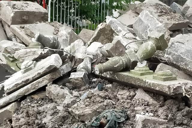 Photos appear to show headstones and concrete balustrades from the cemetery broken and 'piled up' by the entrance from Montague Street. The council has now explained where they came from.