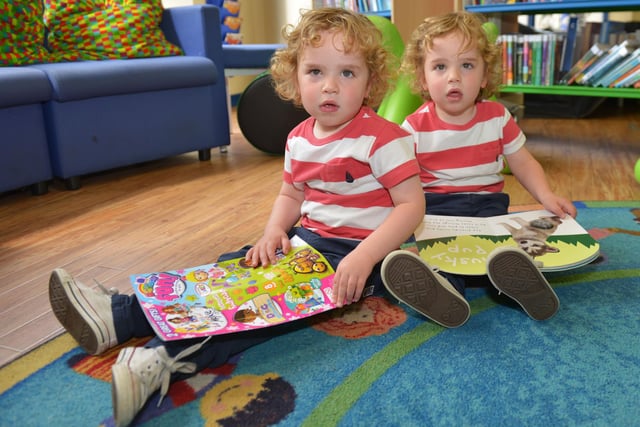 Twins Tom (left) and Ellis Roberts with their books at a read and rhyme session held in the Central Library.
