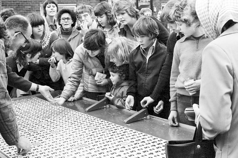 Rolling pennies was a popular pastime at the Redcar House Hostel Garden Fete on Sunderland's Red House Estate in 1979.