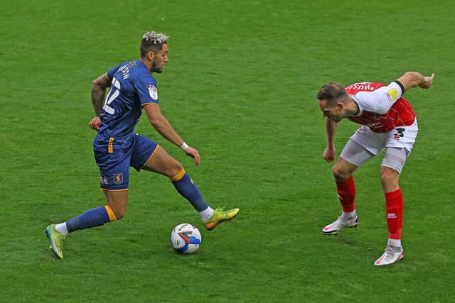 Mansfield Town's Kellan Gordon takes on Cheltenham Town's Chris Hussey - Picture Gareth Williams/AHPIX LTD