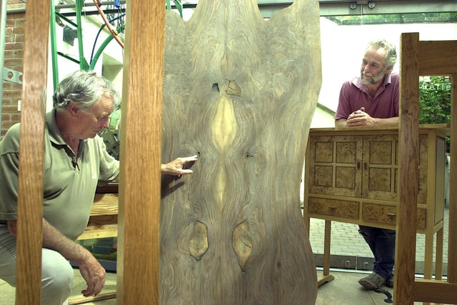 Don Valley Guild of Artists exhibition organiser Dennis Shaw (left), of Kirk Sandall, and cabinet maker Michael Cowie, of Bennetthorpe, with some of Michael's work, and that 300 year-old piece of walnut