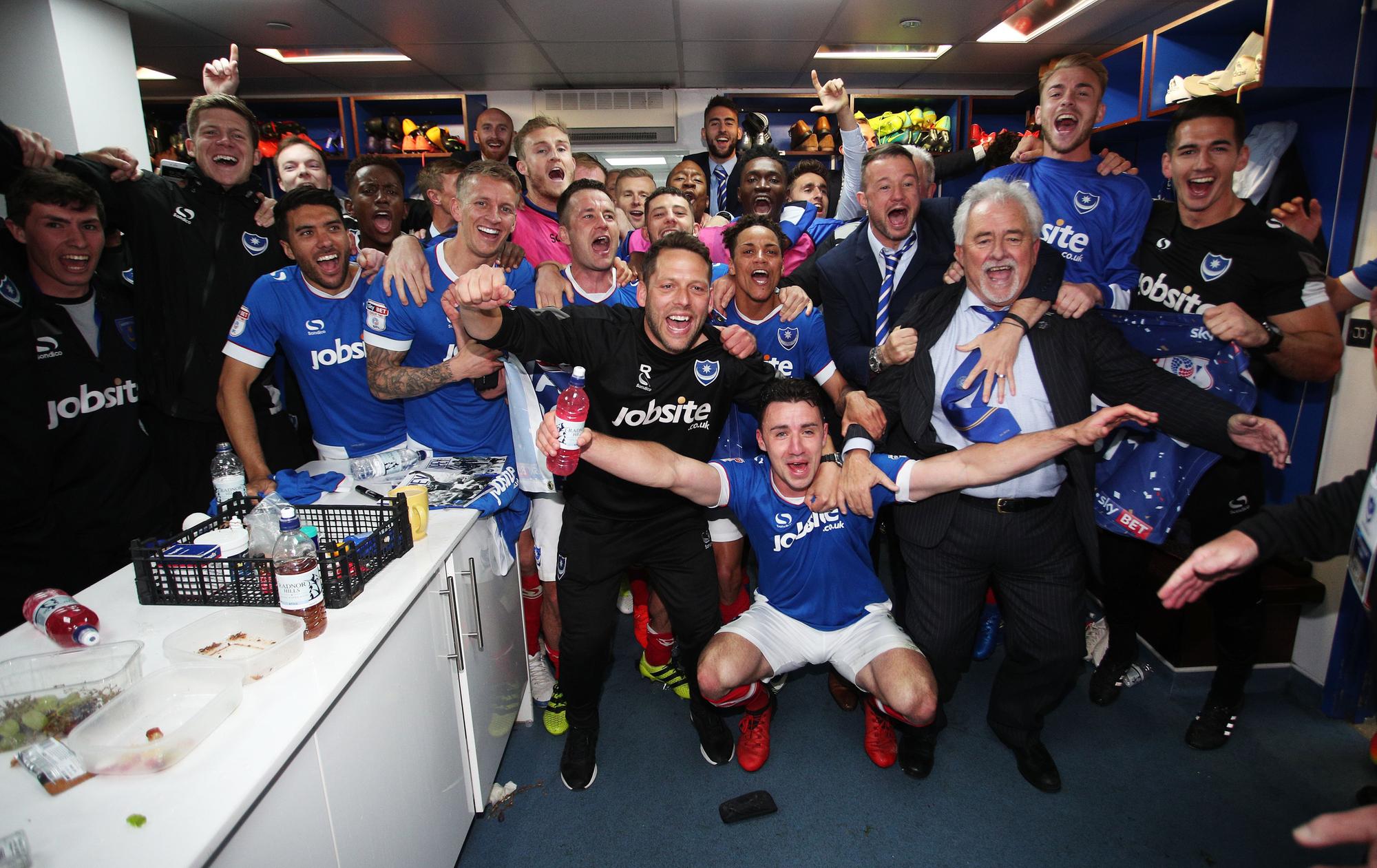 The players toast the success in the dressing room.