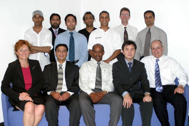 Abdulhakim Wais (centre, front row) and Nigel Tomlinson (far right, front row) pictured with other members of the Sheffield Black Minority and Ethnic Business Forum in 2003