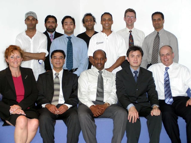 Abdulhakim Wais (centre, front row) and Nigel Tomlinson (far right, front row) pictured with other members of the Sheffield Black Minority and Ethnic Business Forum in 2003