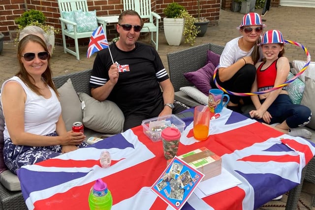 Victoria, Darren, Aimee and Laura Hanson relaxing at their home on VE Day. Picture by Frank Reid
