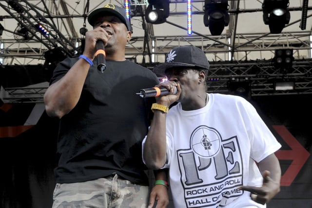 Hip Hop giants Public Enemy on the stage at Devonshire Green at Tramlines in 2014. Chuck D and Flavor Flav on stage