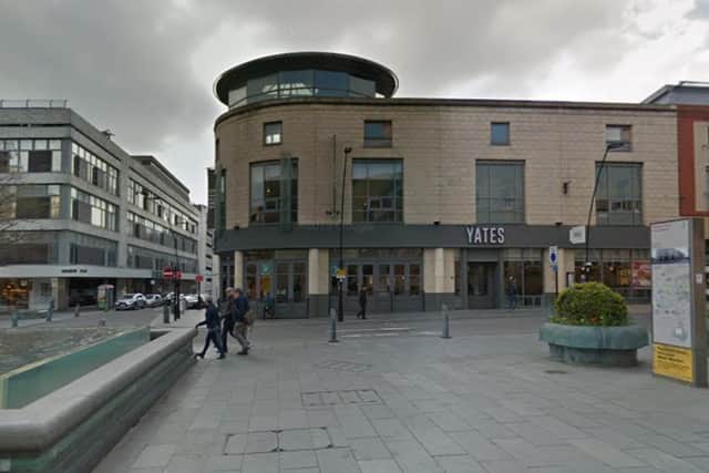 A woman was captured hurling racist abuse at a man outside Yates in Sheffield city centre