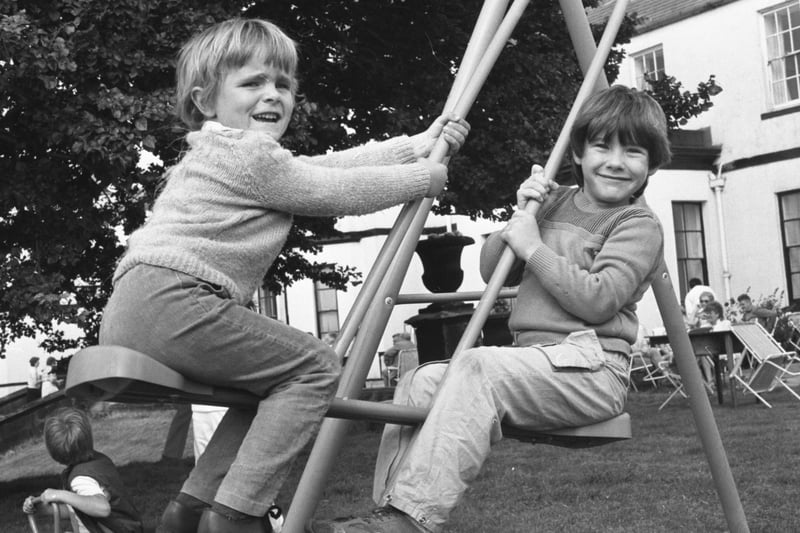 A garden fete at Seaham Hall in 1985 with Tony Grant (left) and Paul Turnbull enjoying the seesaw.