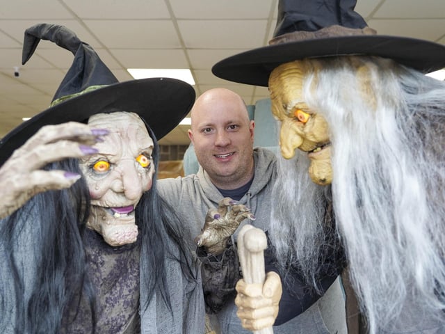 Danny Slinn with part of the Hallowe'en window decorations at Talbot's Upholstery in Southey, Sheffield. Picture Scott Merrylees